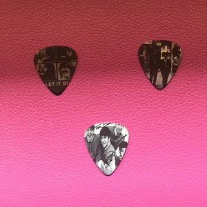 Three The Beatles guitar picks